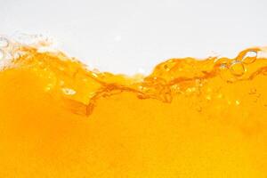 Close up bright orange Oil or beer splash texture and nature waves, Beautiful waves curve and little bubbles smooth for graphic design and background, Oil Bubbles, Soft beer bubbles, Selecti photo