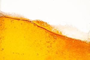 Close up bright orange Oil or beer splash texture and nature waves, Beautiful waves curve and little bubbles smooth for graphic design and background, Oil Bubbles, Soft beer bubble photo