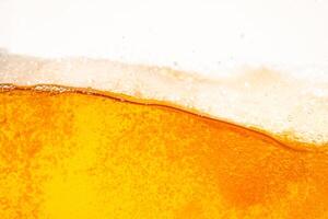 Close up bright orange Oil or beer splash texture and nature waves, Beautiful waves curve and little bubbles smooth for graphic design and background, Oil Bubbles photo