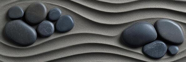 Zen garden sand pattern with smooth stones creating ripple effect photo