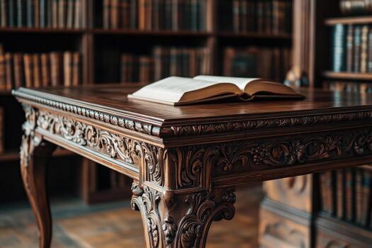Ornately carved wooden table with open book in antique library setting photo