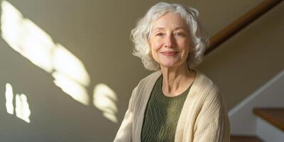 Elderly woman smiling in sunlit indoor setting reflecting warmth and contentment photo