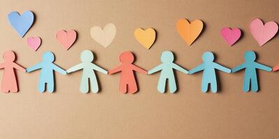 Colorful paper cutout figures and hearts symbolizing unity and love photo