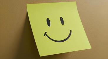 Yellow Sticky Note with a Smiley Face Symbolizing Happiness and Mental Health Awareness. A cheerful note for promoting positivity and well-being. Hand-Drawn Smiley Face on a Bright Yellow Sticky Note photo