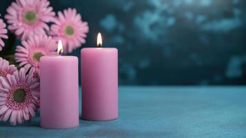 Soft pink candles beside fresh flowers create serene atmosphere photo