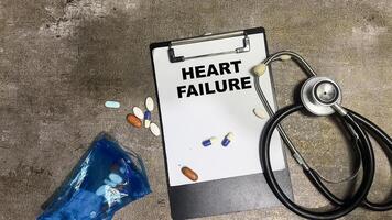 Concept of Heart Failure write on paperwork isolated on Wooden Table. photo