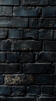 Rough black brick wall with textured surface photo