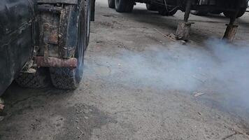 combustion products from the exhaust pipe of a large vehicle - smog, pollution video
