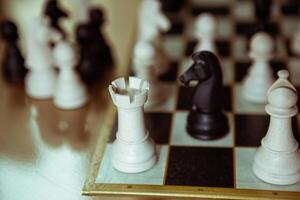 Player making a strategic move in a tense chess match, showcasing focus, concentration, and intelligence photo