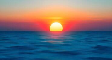 The sun is setting over the ocean in this image photo