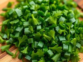 A pile of chopped green onions on a cutting board photo