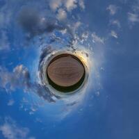 A small planet with a sky and clouds photo