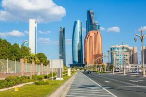 Abu Dhabi, UAE 04 january 2025 Futuristic Abu Dhabi skyline with sleek skyscrapers lining the city streets photo