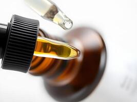 A bottle of cbd oil is being poured into a glass photo