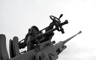 Old Large-Caliber Ship Gun Isolated On White photo