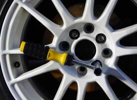 Wheel Wrench For Mounting Car Rim Inserted In Wheel photo