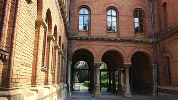 Colonnade And Forged Gate At Inner Courtyard Of Ancient Castle photo