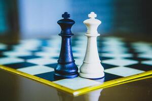 Competitive chess tournament with players engaged in deep concentration over a chessboard photo