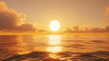 Golden hour sunset illuminating ocean surface with cloudy soft sky in the background photo