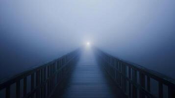 A serene perspective wooden pathway disappearing into a dense ethereal fog landscape photo