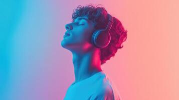A man wearing headphones and looking up photo