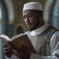 A muslim man reading the quran in a mosque photo