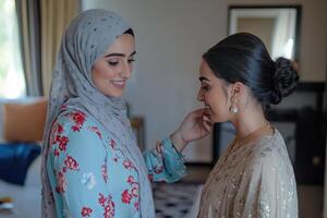 Two women in hijab are getting ready for their wedding photo