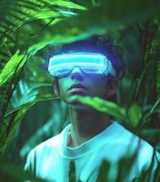 A man wearing a futuristic looking glasses in the jungle photo