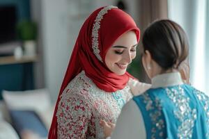 A woman in a hijab is helping another woman in a hijab photo