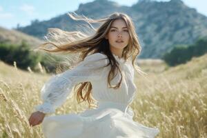 A woman in a white dress running through a field photo