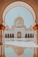 A white mosque with arches and pillars photo