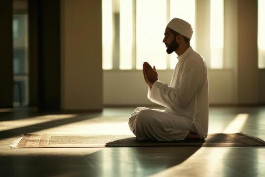 Muslim man praying in the mosque photo