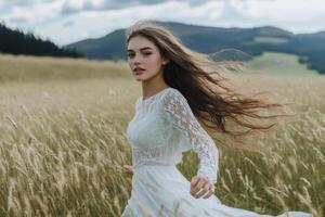 A woman in a white dress running through a field photo