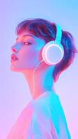 A woman wearing headphones in front of a neon background photo