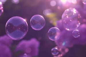 Soap bubbles floating in the air over purple flowers photo