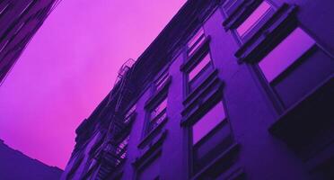 Purple and black building with fire escape photo