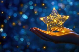 A hand holding a star on a blue background photo