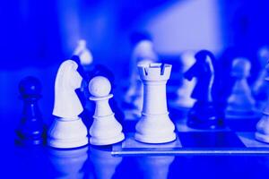 Chess game setup with pawns and knights in position, ready for a strategic battle photo