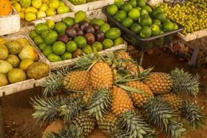 an pineapple fruit stall in the winter season at the local market in sri lanka, asia photo