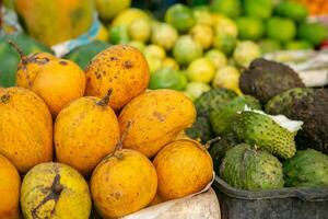 tasty exotic fruits at local market in sri lanka, asia photo