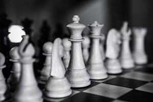 Close-up of a chessboard with dramatic lighting, representing strategic thinking, planning, and decision-making in business and life photo