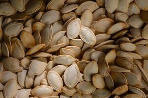 Harvesting pumpkin seeds in a rustic setting during autumn days evokes warmth and nostalgia photo