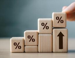 Interest Rate and Mortgage Growth Concept with Wooden Blocks and Bar Chart photo