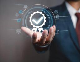 Standard quality control certification concept with a businessman presenting a guarantee seal photo