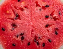 Watermelon Fruit Background with Vibrant Red Pulp and Seed Pattern photo