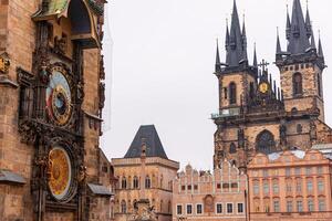 Prague astronomical clock and Church of Our Lady before Tyn showing amazing architecture photo