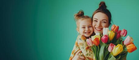 Happy woman and child with beautiful spring flowers against green background and Copy Space for Text . Family holiday concept. Mothers day photo