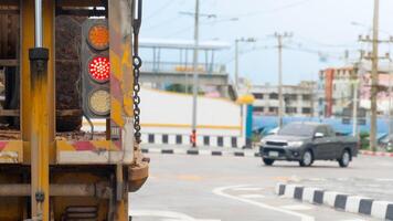 Rear side view of truck heavy car. with turn on brake light. opposit of car with blurred of pickup car driving through an intersection. on concreate road. photo