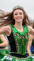 Dancer in green costume performing joyfully with flowing hair photo