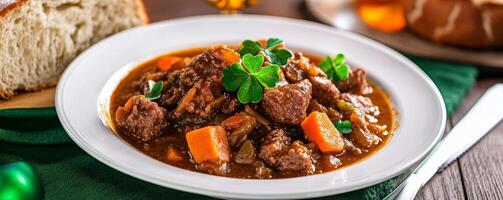 Delicious Irish stew with vegetables and clover garnish photo